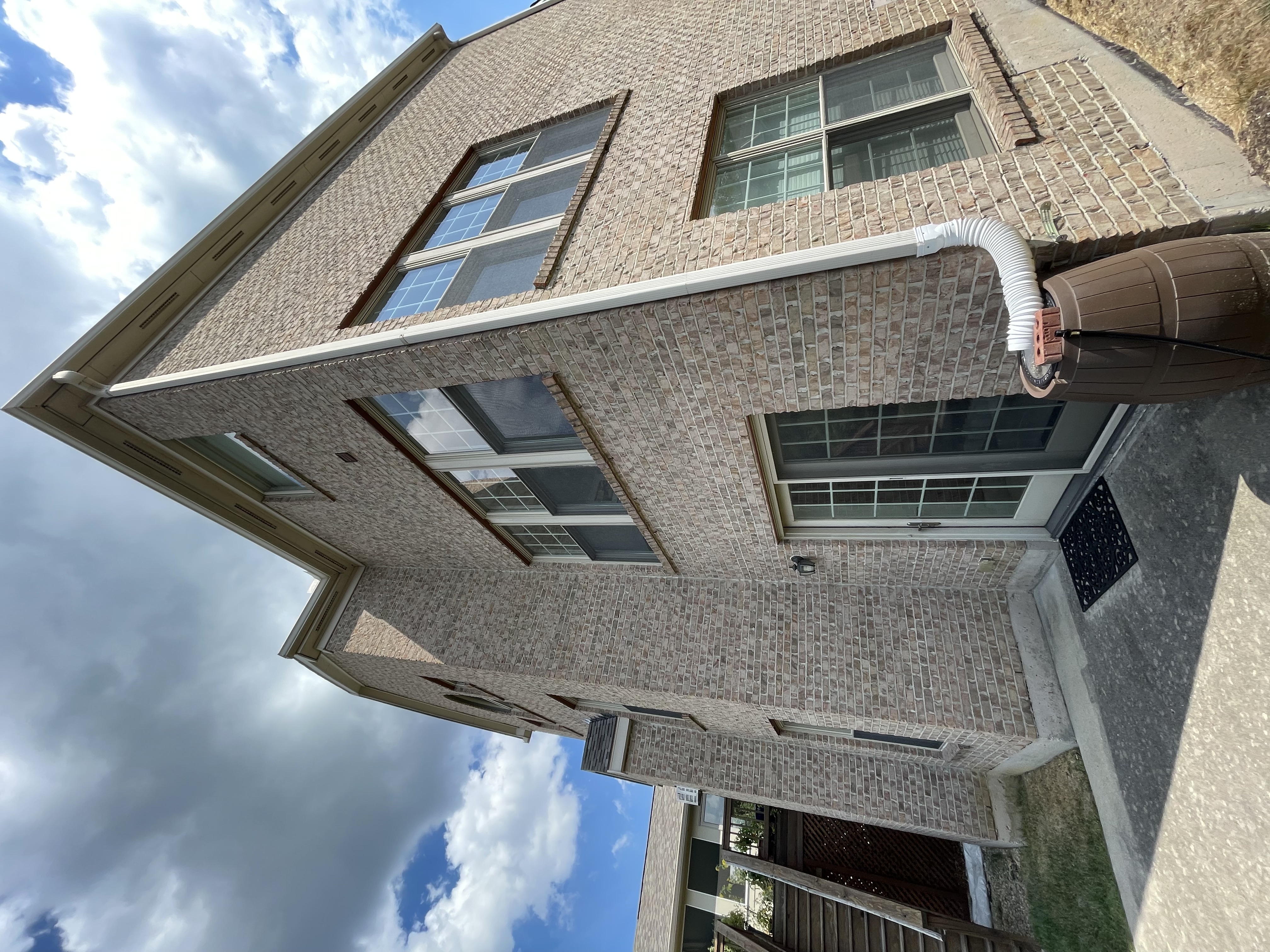 Professionally pressure-washed brick home exterior in Clearwater, FL — Caldwell Clean results